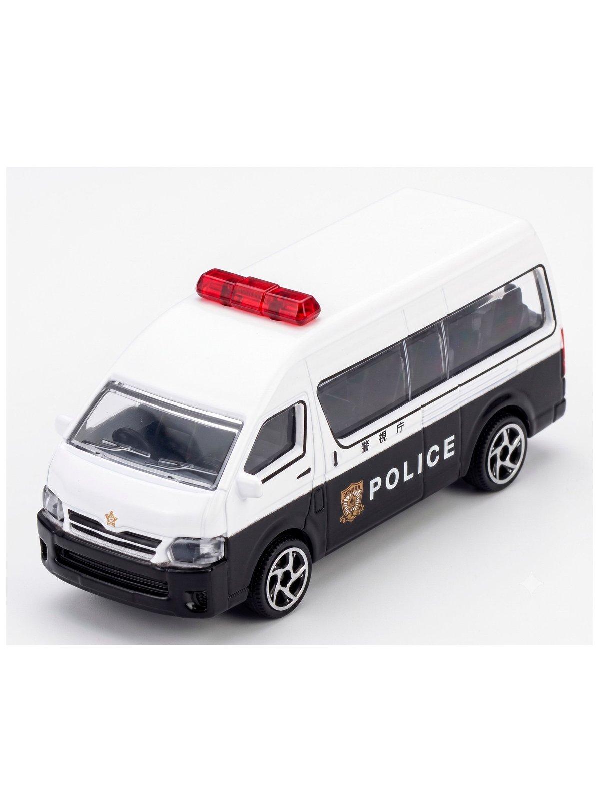 Detalle del Toyota HiAce de policía con baliza roja y ventanas laterales