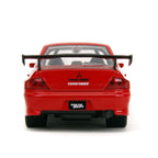 Parte trasera del Lancer Evo IX con alerón y placa Tokyo Drift
