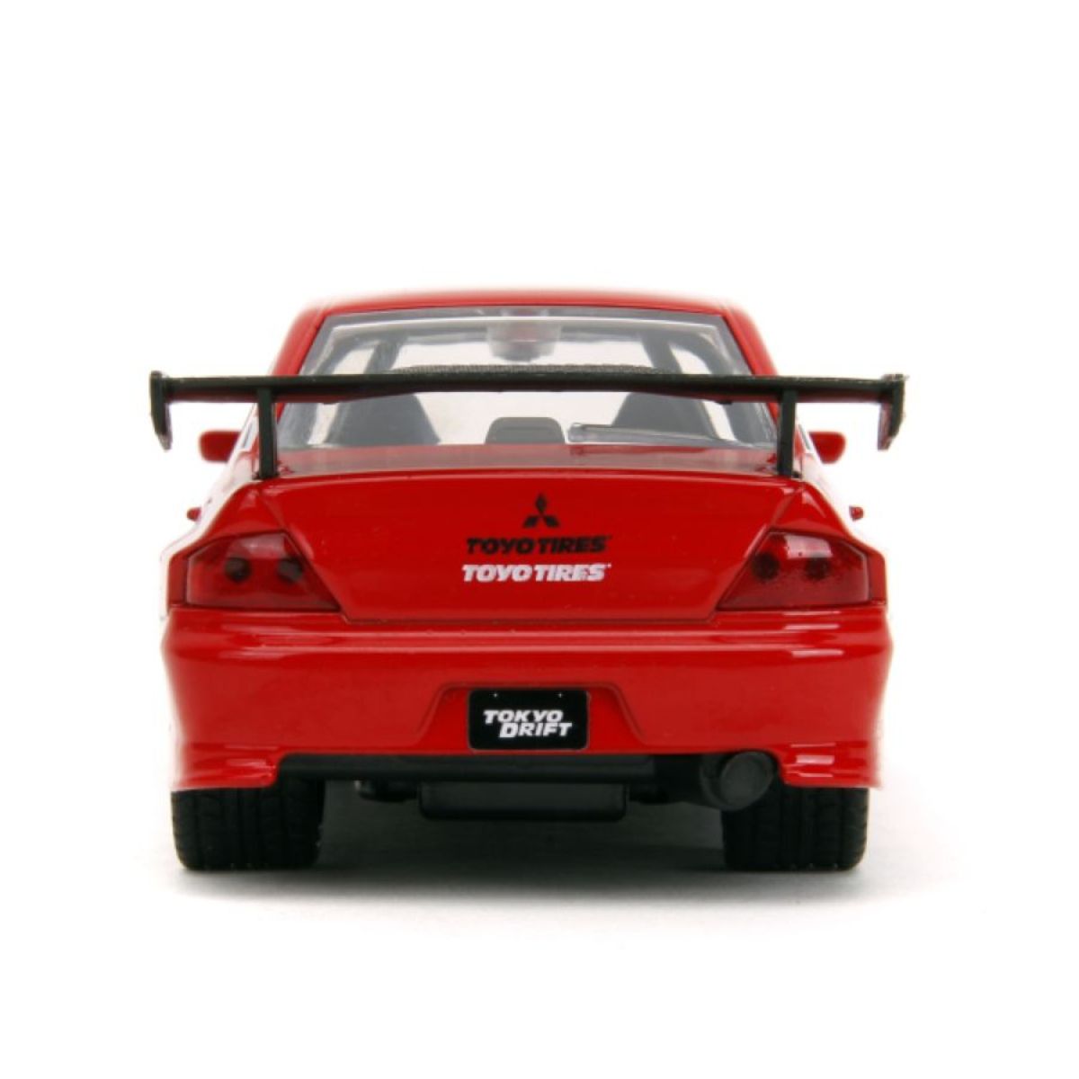 Parte trasera del Lancer Evo IX con alerón y placa Tokyo Drift