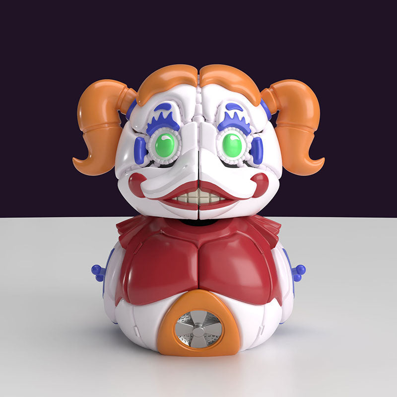 Mini Tubbz Circus Baby de frente con coletas naranjas y ojos verdes