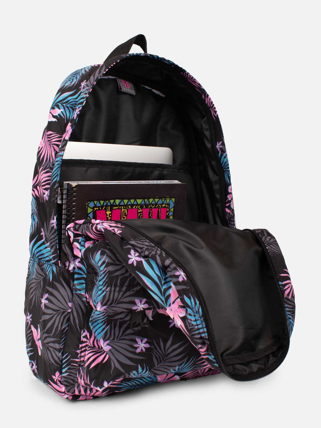Mochila floreada Maui and Sons abierta mostrando compartimento para notebook y cuadernos