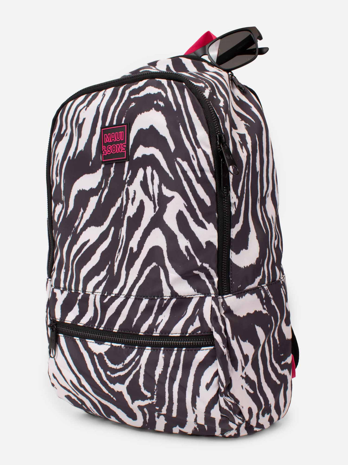 Mochila Maui and Sons con estampado de cebra blanco y negro y asa fucsia, vista lateral