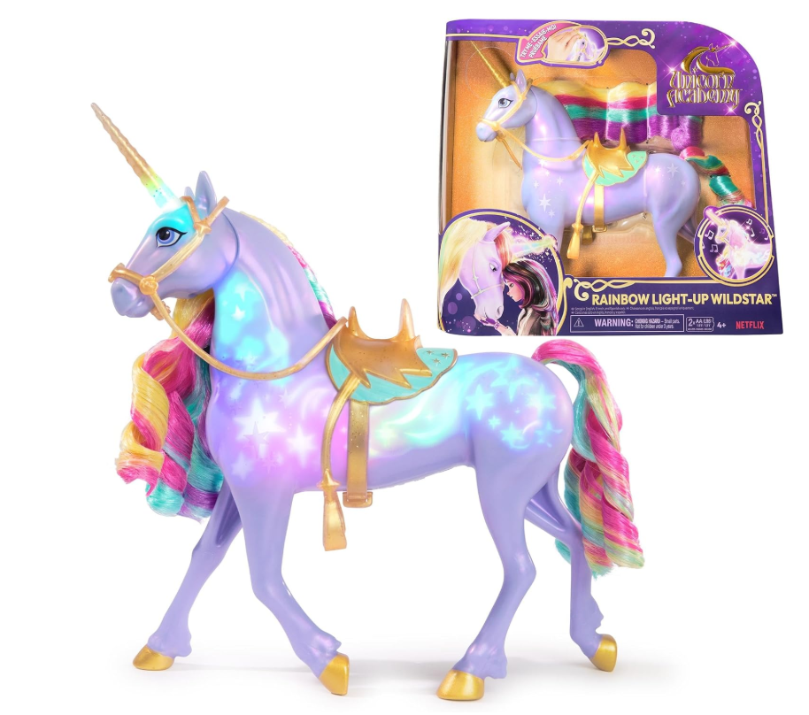 Unicornio Wildstar lila con crin arcoíris y marcas iluminadas junto a su caja