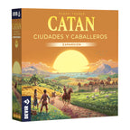 Caja en 3D de Catan Ciudades y Caballeros, expansión de Devir con paisaje al atardecer