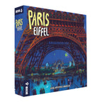 Caja de la expansión Paris Eiffel de Devir con la Torre Eiffel iluminada de noche