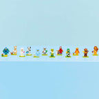 Fila con las 12 minifiguras LEGO Animales Serie 28 sobre sus bases
