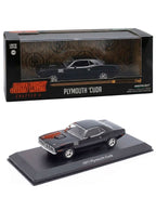 Plymouth Cuda negro de John Wick 4 escala 1:43 junto a su caja Greenlight