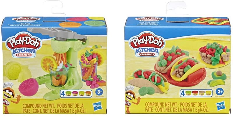 Cajas de los dos modelos del surtido Play-Doh Kitchen Creations: exprimidor de frutas y tacos