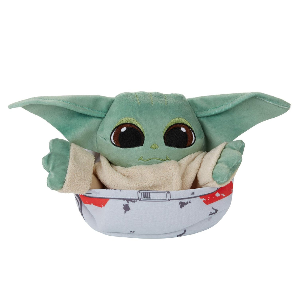 Peluche Grogu sentado dentro de su hover-pram de tela