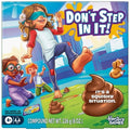 Caja del juego Don't Step In It de Hasbro Gaming con niña vendada esquivando cacas de masa