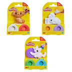 Tres modelos del set Play-Doh mini mascotas: perrito, conejo y gatito en su empaque