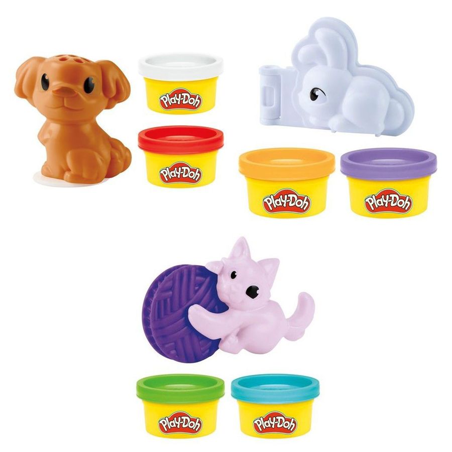 Accesorios de perrito, conejo y gatito Play-Doh junto a latas de masa de colores