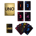 Caja dorada de UNO Gold Edition junto a cartas negras con números de colores