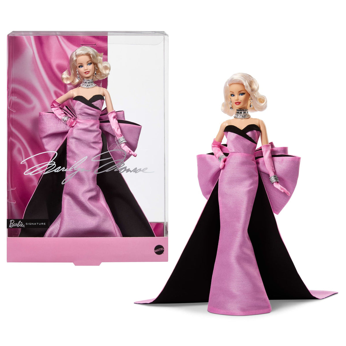 Muñeca Barbie Marilyn Monroe con vestido rosado junto a su caja de colección
