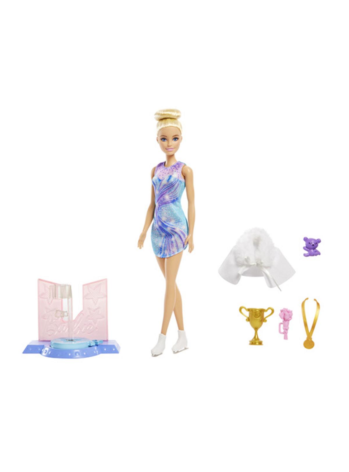 Barbie patinadora junto a su base, chaqueta, trofeo y medalla