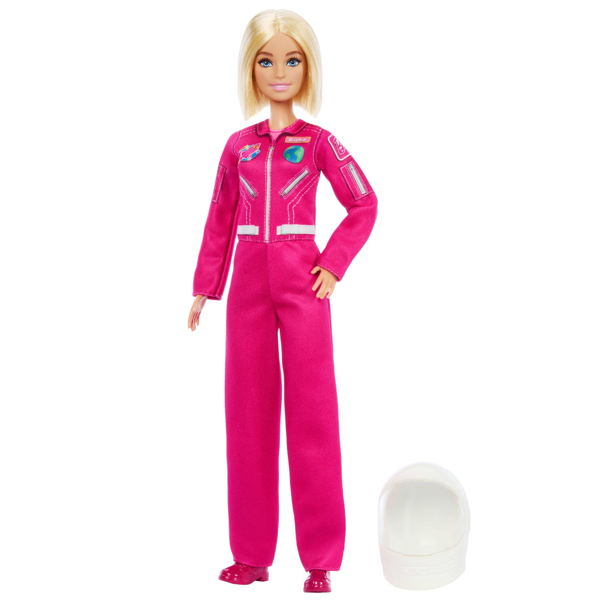 Muñeca Barbie astronauta con traje espacial rosado y casco blanco a su lado