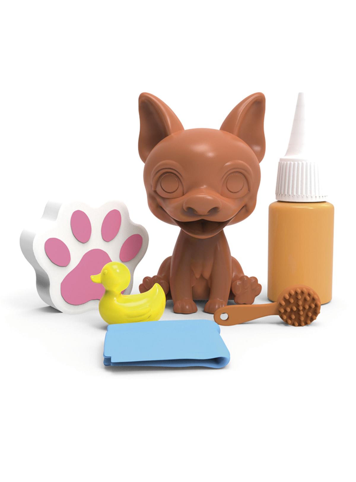 Contenido del set Washy Friends: perrito con barro, bote de barro, esponja de huella, patito, cepillo y toalla