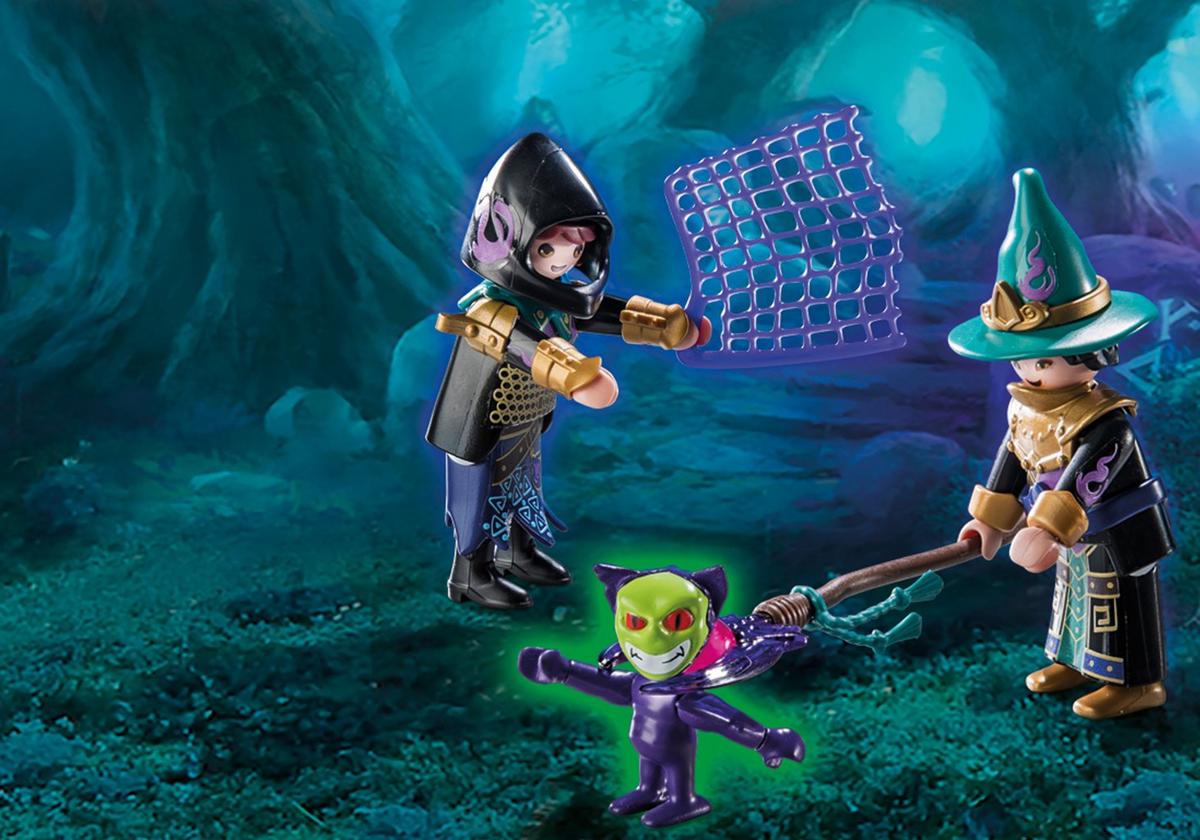 Magos de Violet Vale lanzan una red para atrapar al pequeño demonio verde