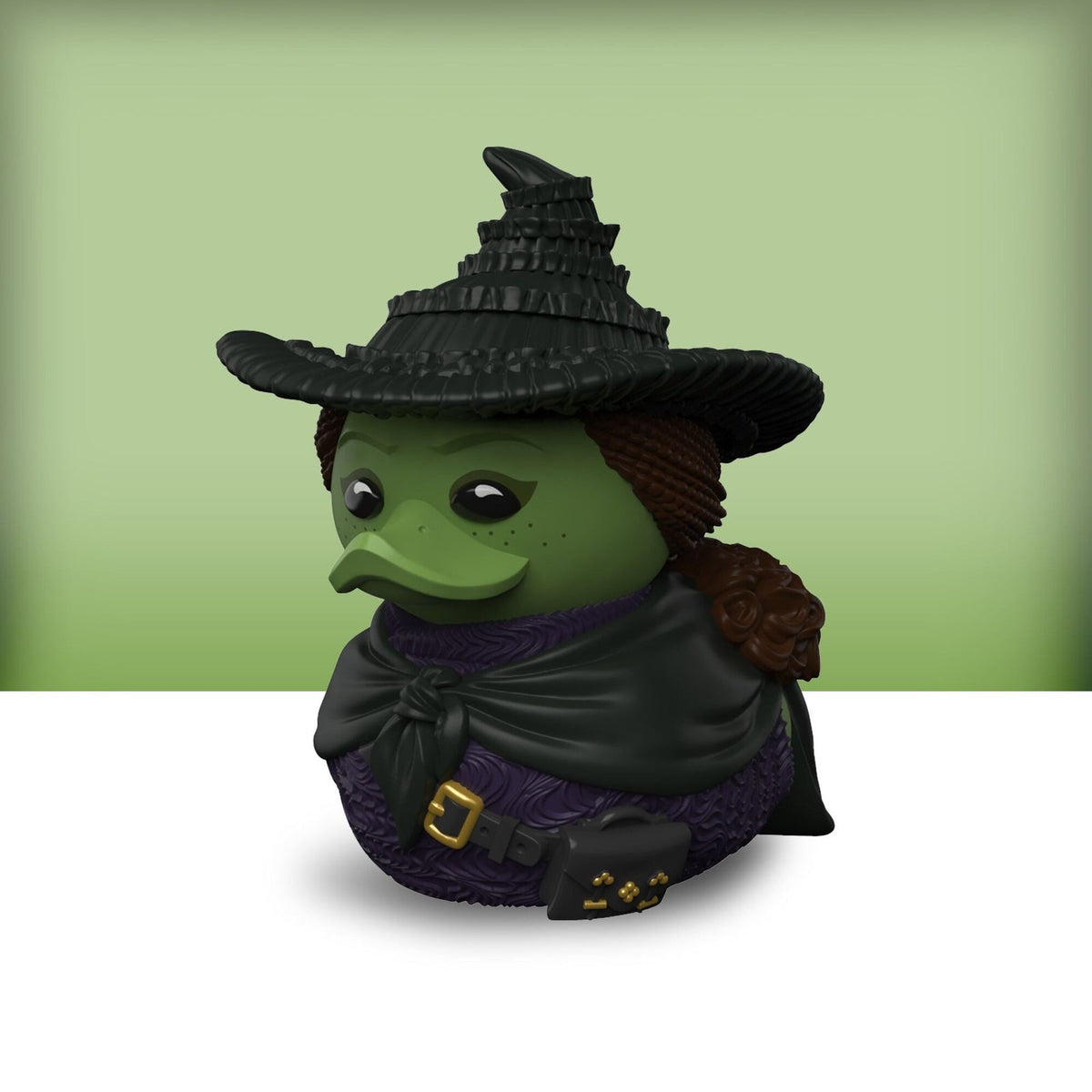 Vista trasera del Mini TUBBZ Elphaba con su capa
